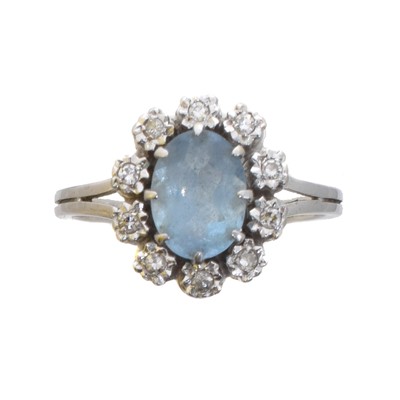 Lot 113 - An 18ct gold aquamarine and diamond cluster ring.