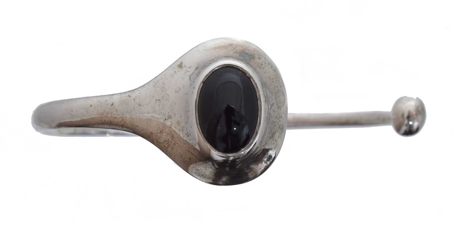 Lot 20 - A silver onyx bangle by Georg Jensen, no. 269L.