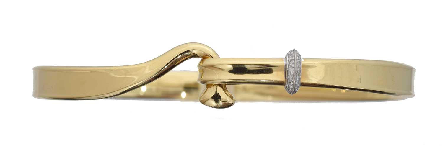 Lot 31 - An 18ct gold diamond 'Torun' bangle by Georg Jensen.