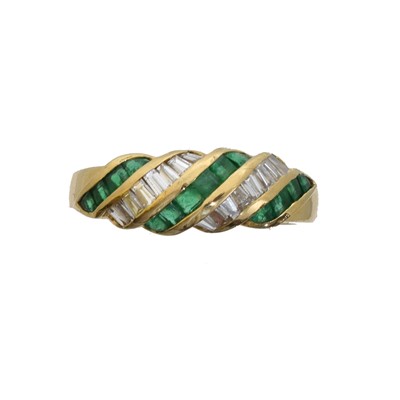 Lot 101 - An emerald and diamond band ring.