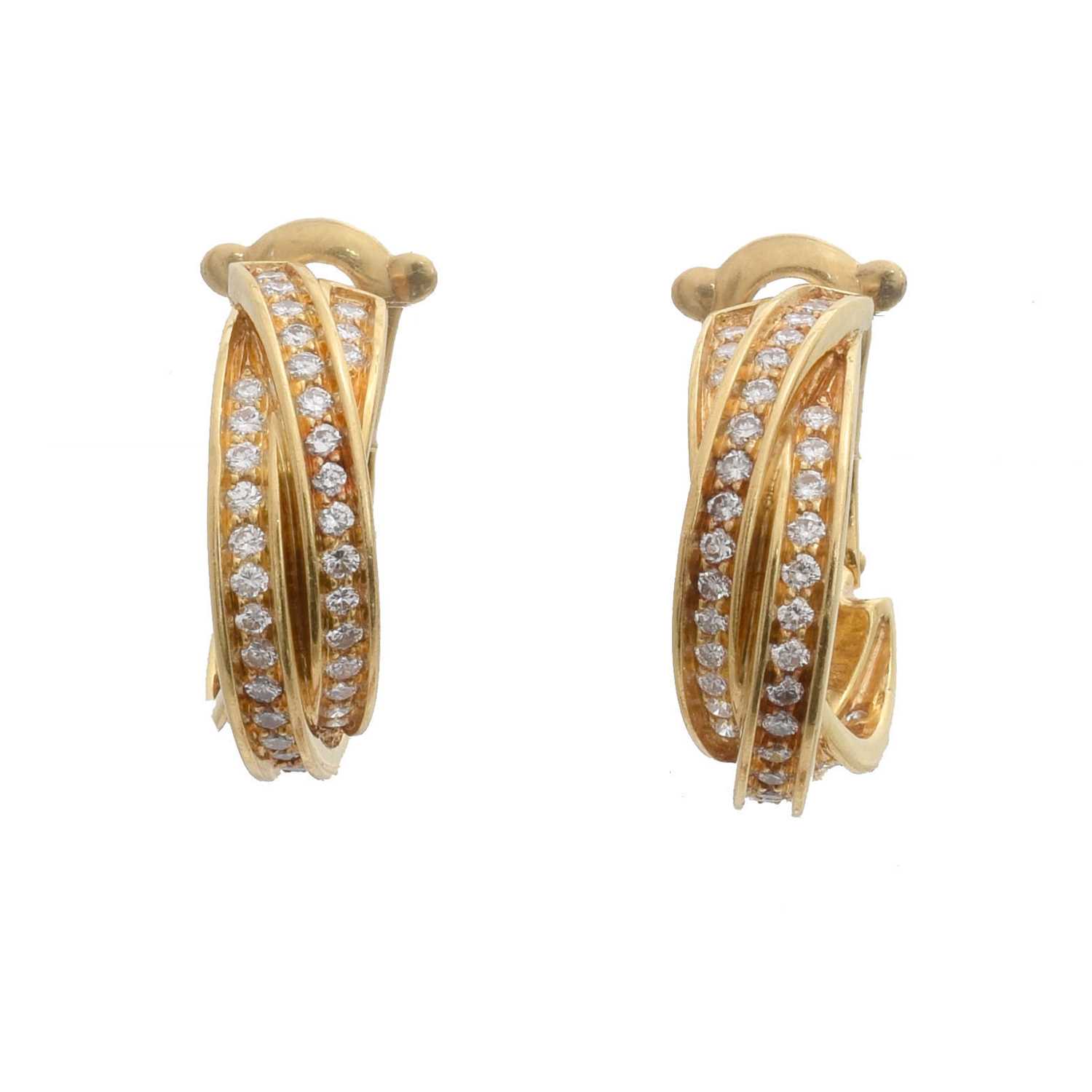Lot 41 - A pair of 18ct gold diamond 'Trinity' hoop earrings by Cartier.