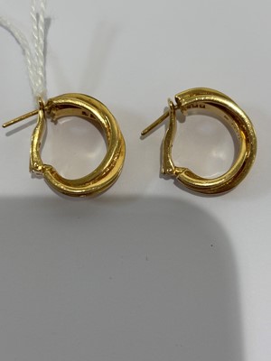 Lot 41 - A pair of 18ct gold diamond 'Trinity' hoop earrings by Cartier.