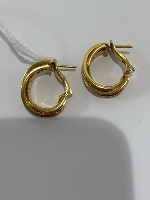 Lot 41 - A pair of 18ct gold diamond 'Trinity' hoop earrings by Cartier.