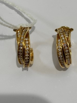 Lot 41 - A pair of 18ct gold diamond 'Trinity' hoop earrings by Cartier.