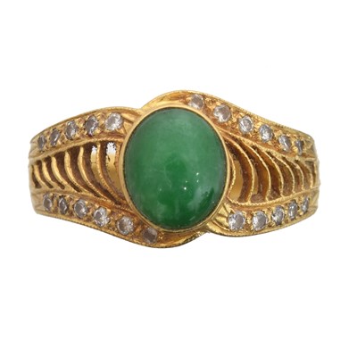 Lot 98 - A jade and diamond dress ring.