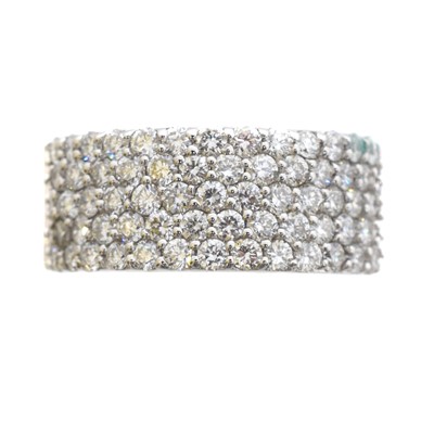 Lot 81A - An 18ct gold diamond band ring.