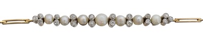 Lot 16 - An early 20th century diamond and pearl bracelet.