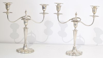 Lot 104 - A pair of George V silver candelabra by Walker & Hall.