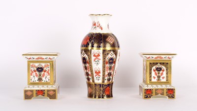 Lot 47 - A Pair of "Old Imari" Candlesticks and a Vase by Royal Crown Derby
