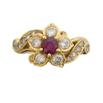 Lot 38 - A ruby and diamond cluster ring.