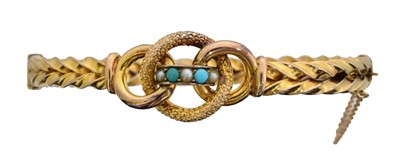 Lot 14 - A turquoise and split pearl hinged bangle.
