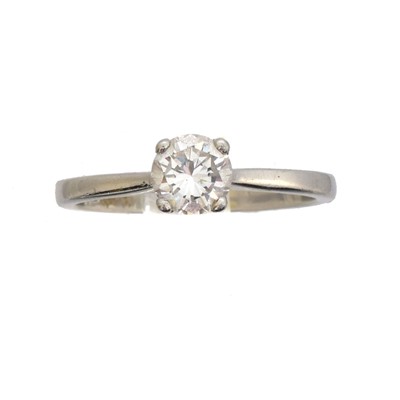 Lot 60 - A platinum and diamond single stone ring.