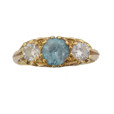 Lot 54 - An 18ct gold zircon and diamond three stone ring.