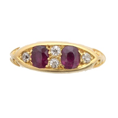 Lot 70 - An 18ct gold ruby and diamond dress ring.