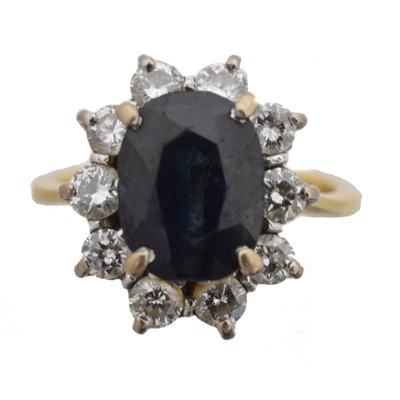 Lot 44 - An 18ct gold sapphire and diamond cluster ring.