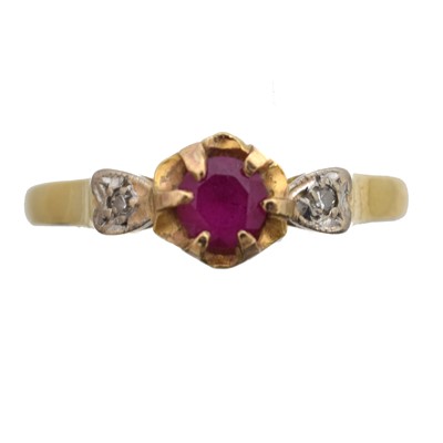 Lot 66 - A ruby and diamond three stone ring, set in gold