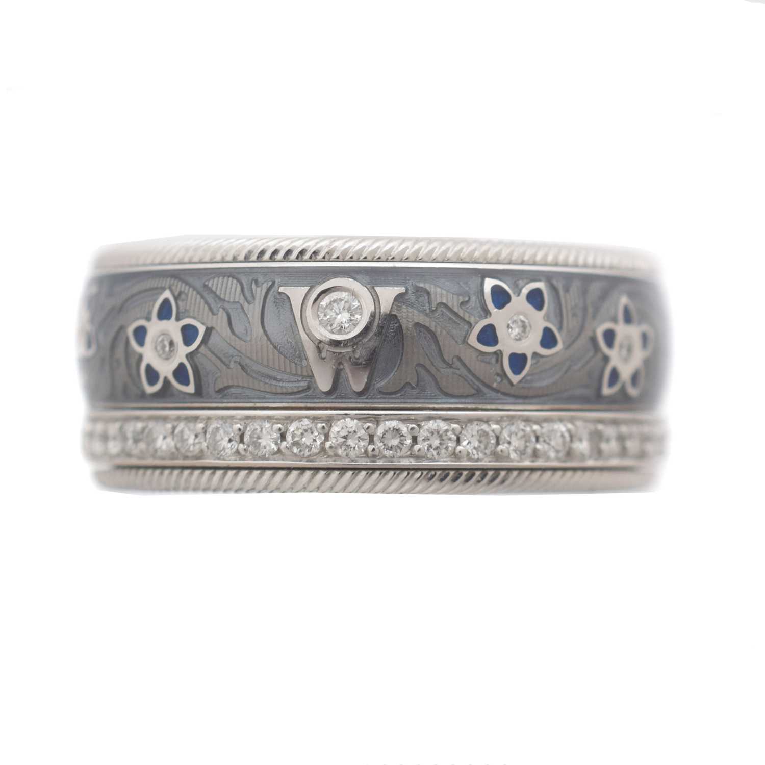 Lot 70 - An 18ct gold Wellendorff 'Blueberry' diamond and enamel spinning band ring, retailed by Boodles