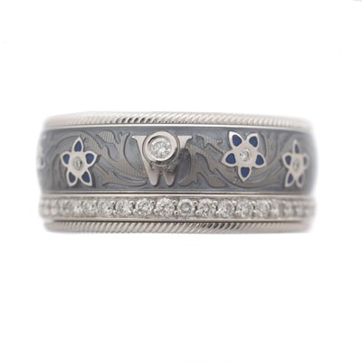 Lot 70 - An 18ct gold Wellendorff 'Blueberry' diamond and enamel spinning band ring, retailed by Boodles