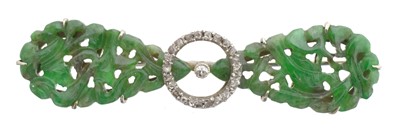 Lot 4 - A jade and diamond brooch.