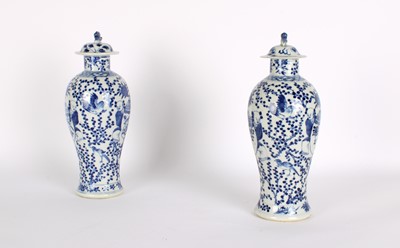 Lot 10 - A Pair of Late 19th Century Chinese Blue and White Slender 'Meiping' Vases with Covers