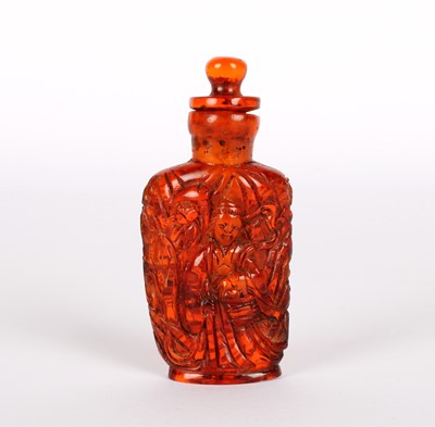 Lot 58 - A Late 19th/Early 20th Century Chinese Carved Amber Snuff Bottle