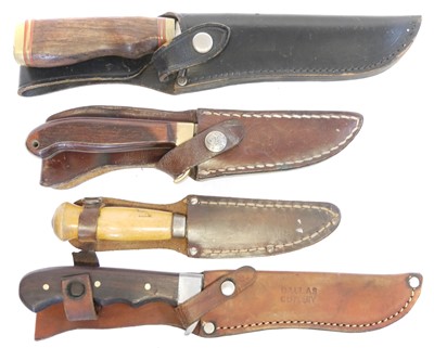 Lot 131 - Four hunting knifes, with slightly curved...