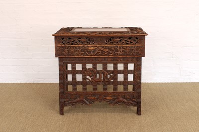 Lot 194 - A Late 19th/Early 20th Century Burmese Table with Folding Legs