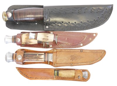 Lot 134 - Five hunting / outdoors knives, the blades...