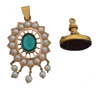 Lot 123 - A yellow metal, green paste and seed pearl pendant