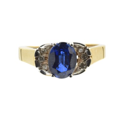 Lot 115 - A yellow metal diamond and synthetic sapphire dress ring