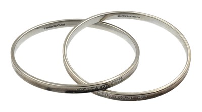 Lot 25 - A sterling silver Tiffany & Co. interlocking double bangle