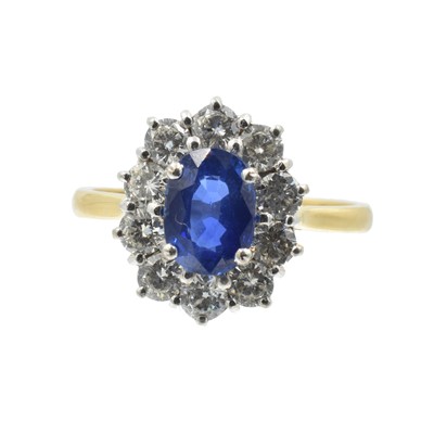 Lot 7 - An oval cut 2.00ct sapphire and diamond cluster ring set in 18ct gold