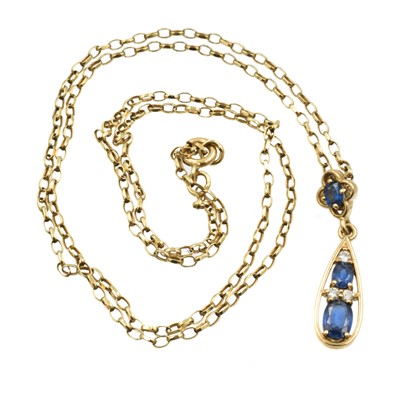 Lot 281 - A synthetic sapphire and diamond drop pendant set in 9ct gold