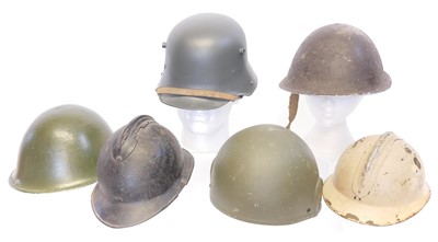 Lot 204 - Six helmets, including two French 'Adrian'...