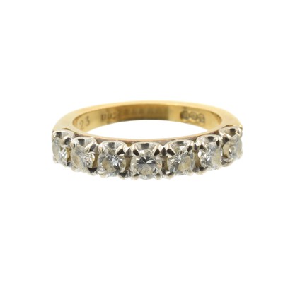 Lot 74 - A 7-stone diamond and gold half eternity ring