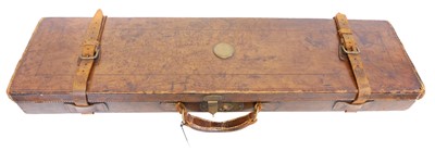 Lot 427 - Leather gun case, with brass fittings and red...