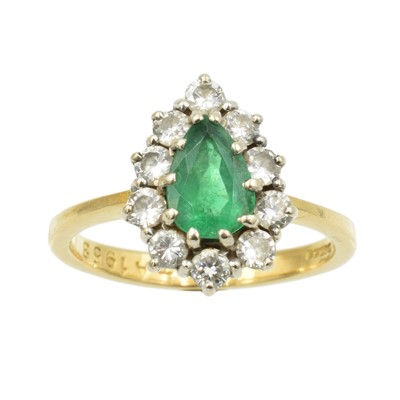 Lot 207 - An emerald and diamond cluster ring set in 18ct gold