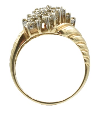 Lot 120 - A 9ct gold and diamond "croissant" style ring