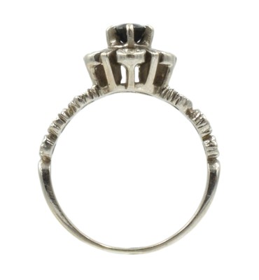 Lot 53 - An 18ct white gold, diamond, and sapphire cluster ring