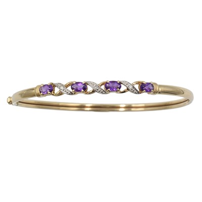 Lot 176 - An amethyst and diamond bangle, set in 9ct gold