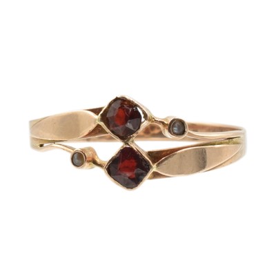 Lot 134 - Three misshapen gold rings of varying purities
