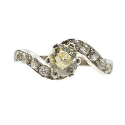 Lot 287 - A diamond solitaire twist ring, set in 18ct gold