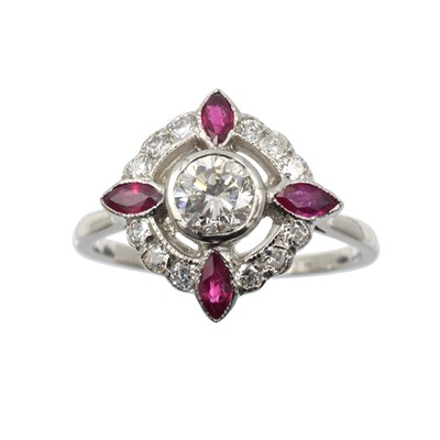 Lot 182 - A vintage ruby and diamond cluster ring, set in platinum