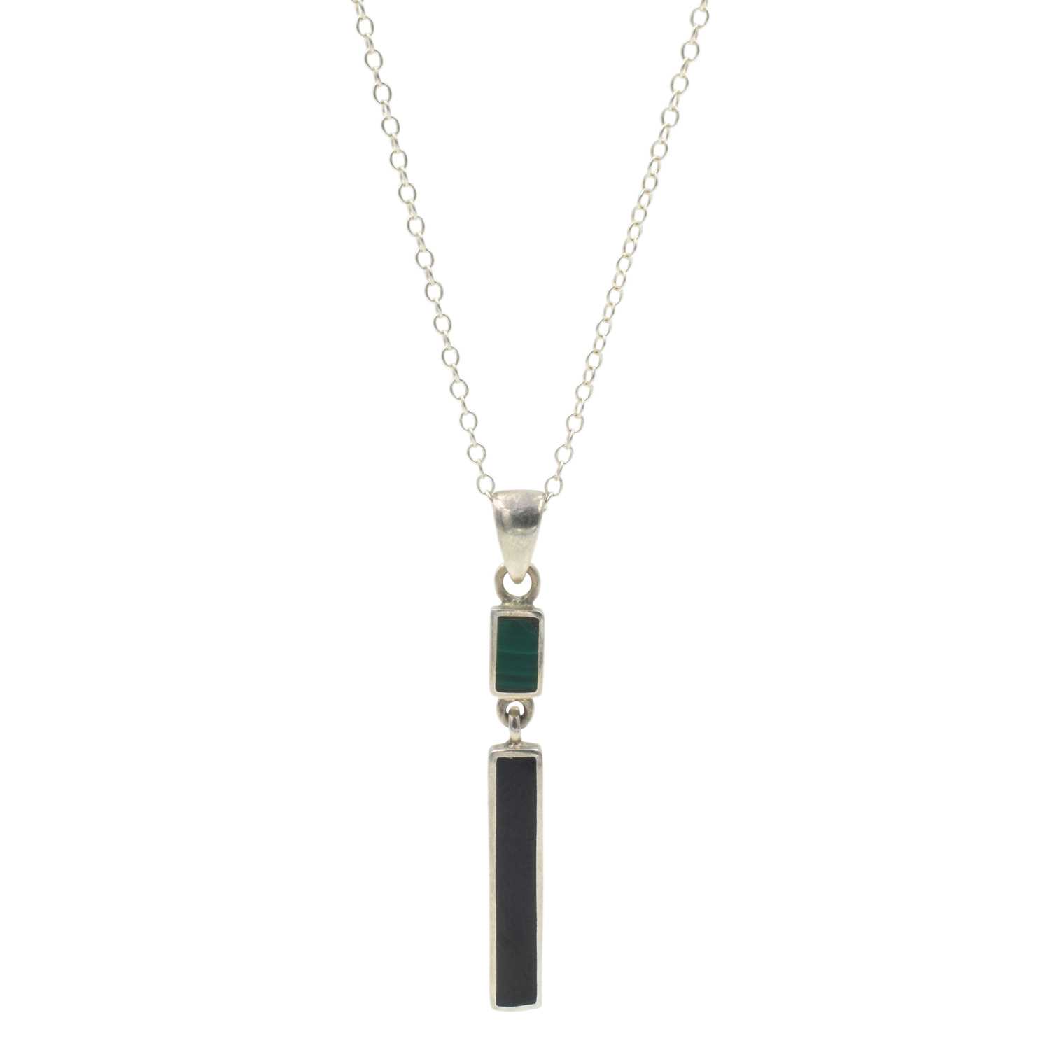 Lot 112 - A malachite and onyx pendant, set in silver