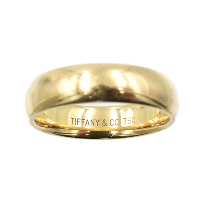 Lot 84 - An 18ct gold wedding band, by Tiffany & Co