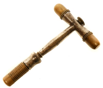 Lot 179 - T shape combination tool for a percussion...