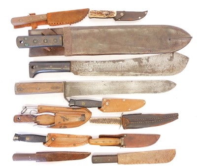Lot 264 - Three machettes and eight other knives and...
