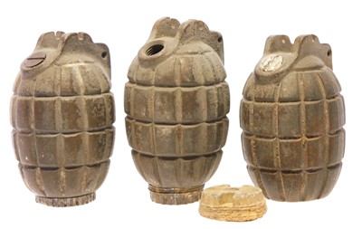 Lot 284 - Three inert Mills Bombs, one with striker...
