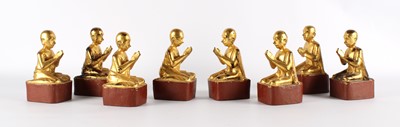 Lot 119 - A Set of Eight Tibetan Carved and Gilded Buddhist Monk Figures
