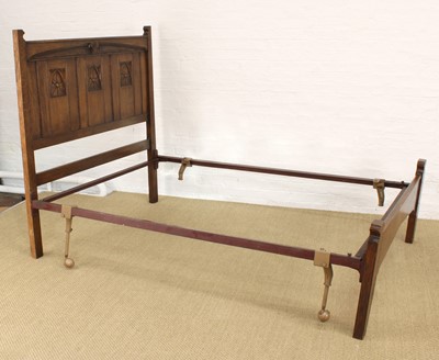 Lot 218 - A Carved Oak Bedframe in the Arts & Crafts Style by Rackstraw of Worcester